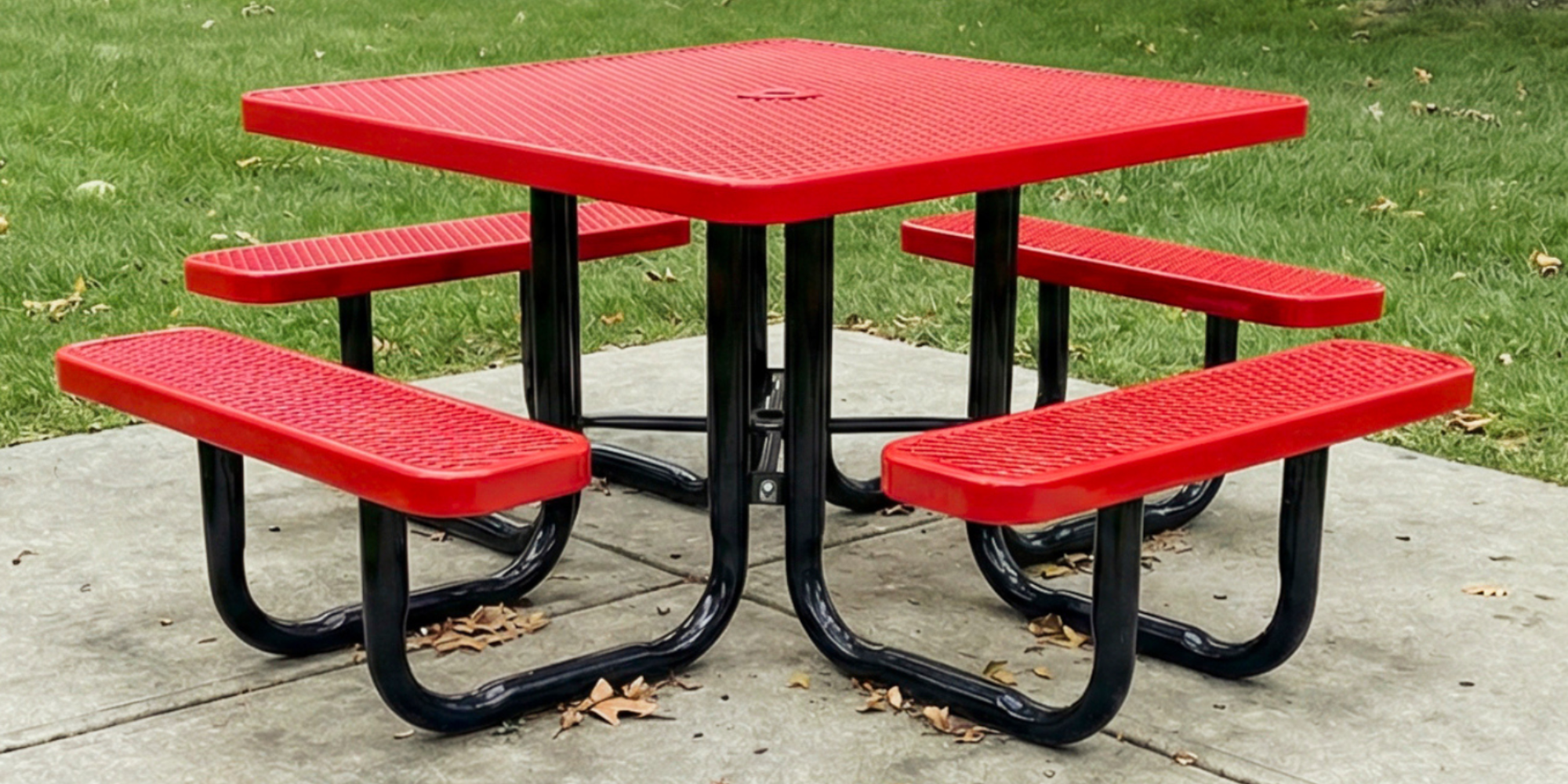Heavy-duty red square expanded metal picnic table with four integrated bench seats and durable powder-coated steel frame designed for long-lasting commercial outdoor furniture and park seating