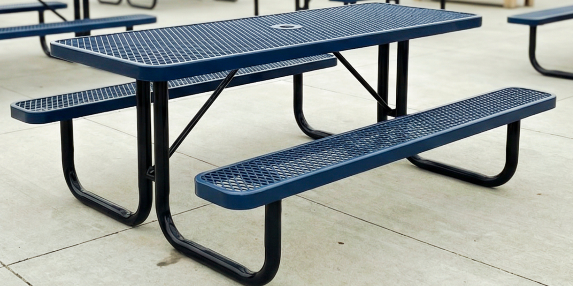 Dark blue rectangular expanded metal picnic table with reinforced steel frame and durable outdoor finish for commercial seating areas