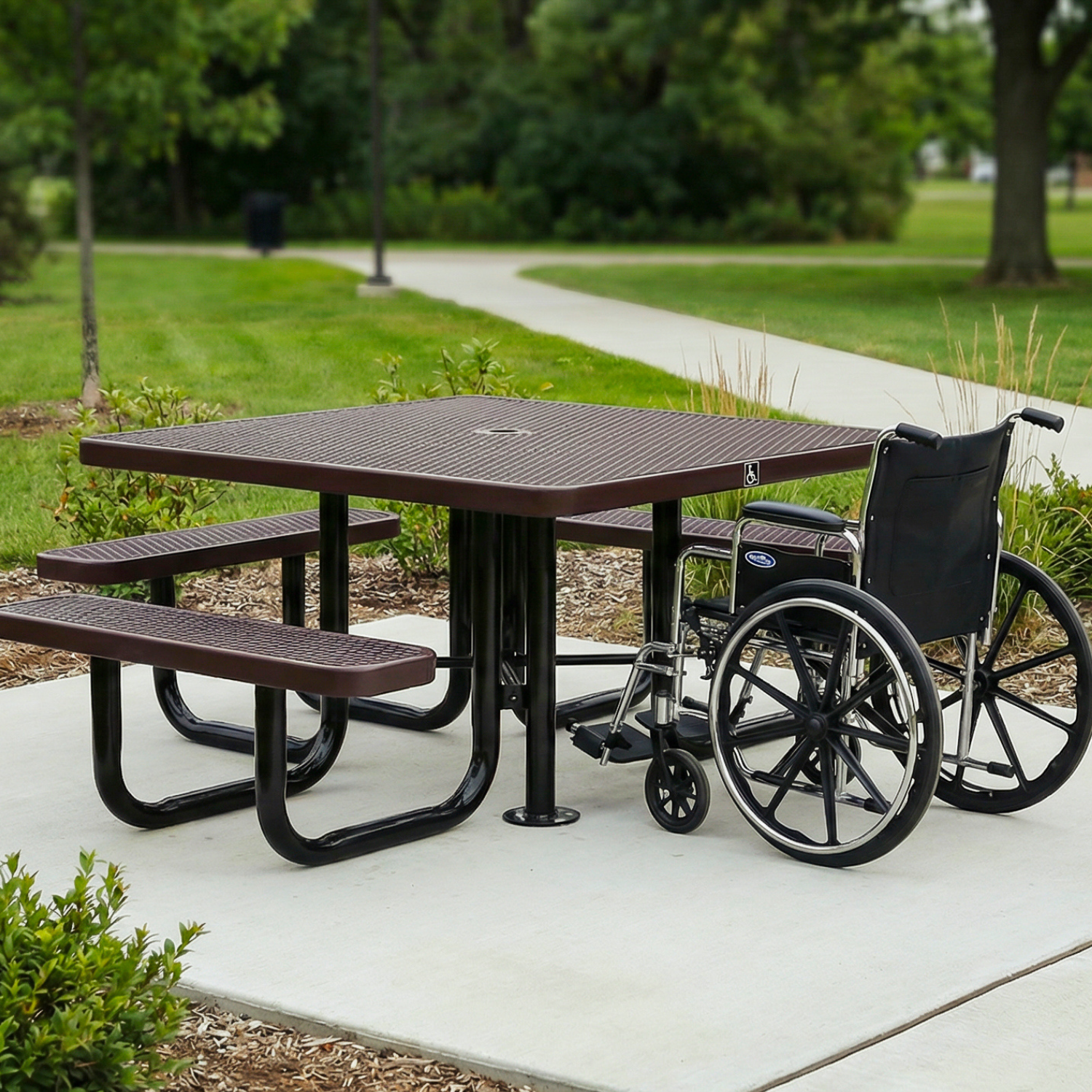 ADA Picnic table with wheelchair on a sidewalk in a park setting