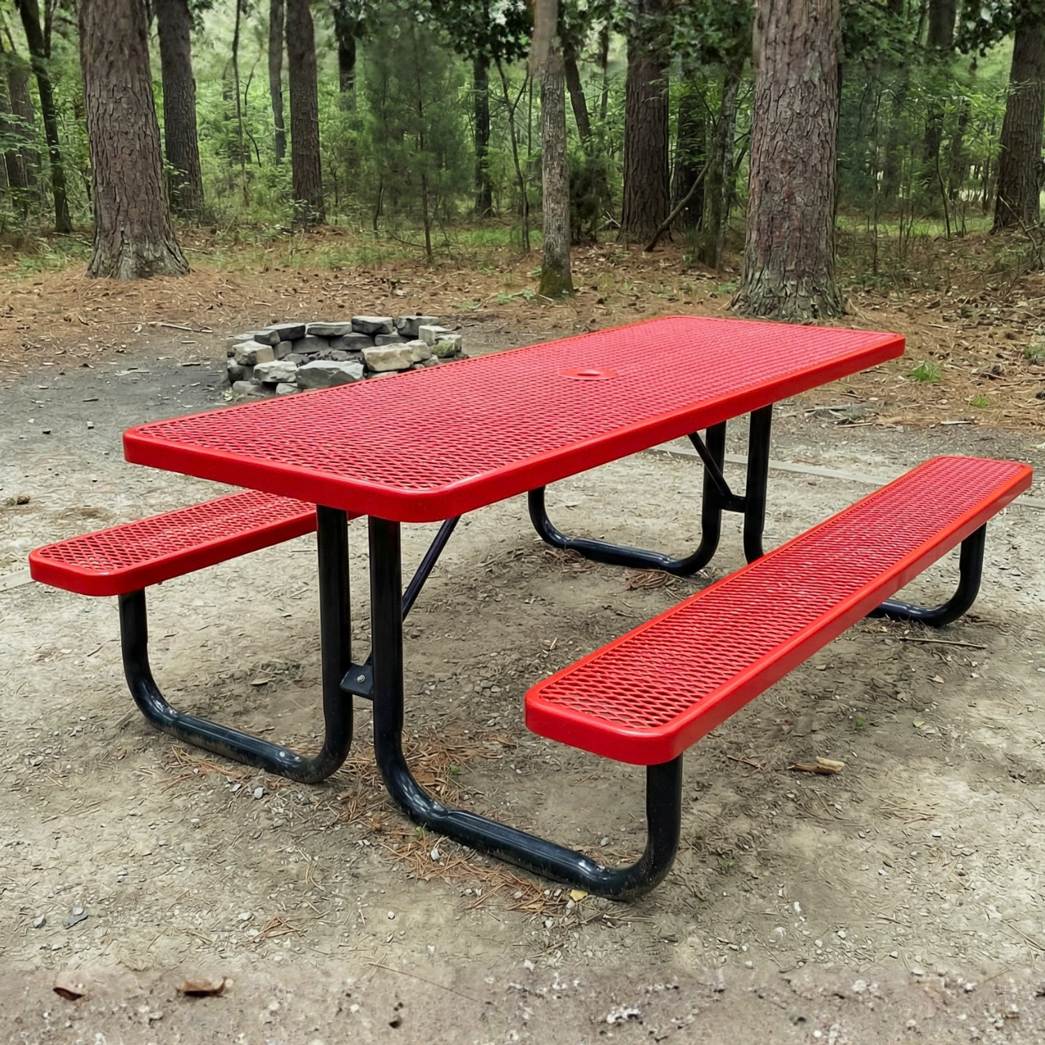 Red picnic table with black legs in a wooded area