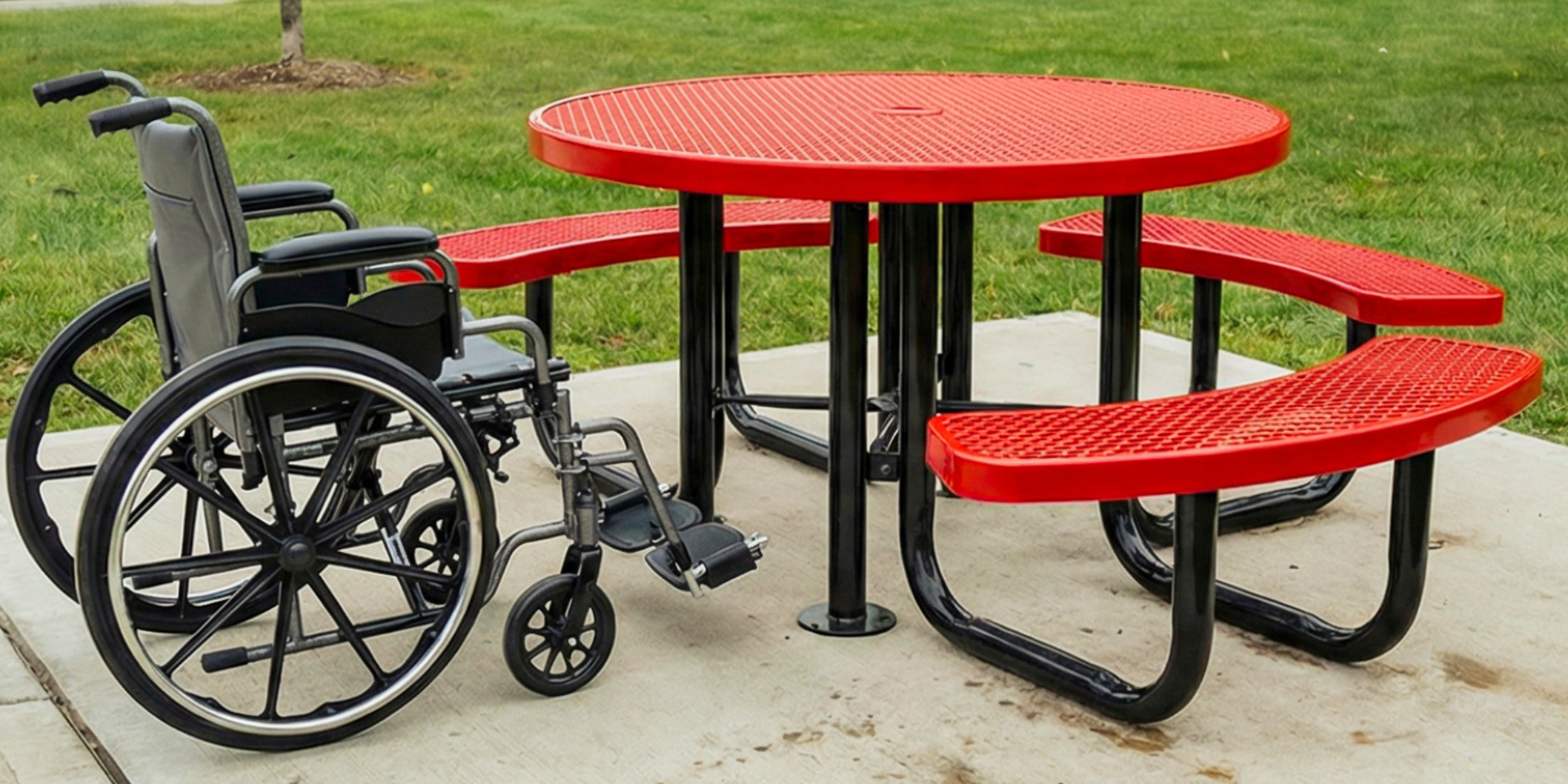 Red ADA accessible round expanded metal picnic table with heavy-duty steel construction and integrated wheelchair seating space for outdoor use