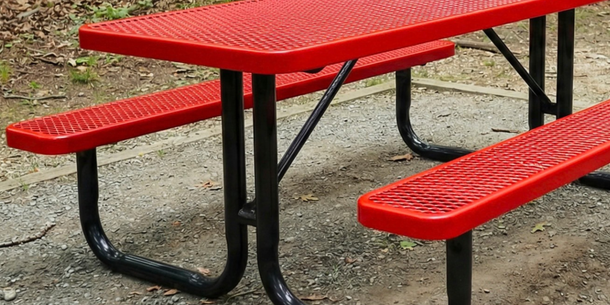 Heavy-duty red expanded metal rectangular picnic table with integrated bench seating and powder-coated steel frame designed for weather-resistant commercial outdoor furniture use